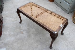 A MID 20TH CENTURY DUET STOOL ON CABRIOLE LEGS WITH SPLIT CANE SEAT