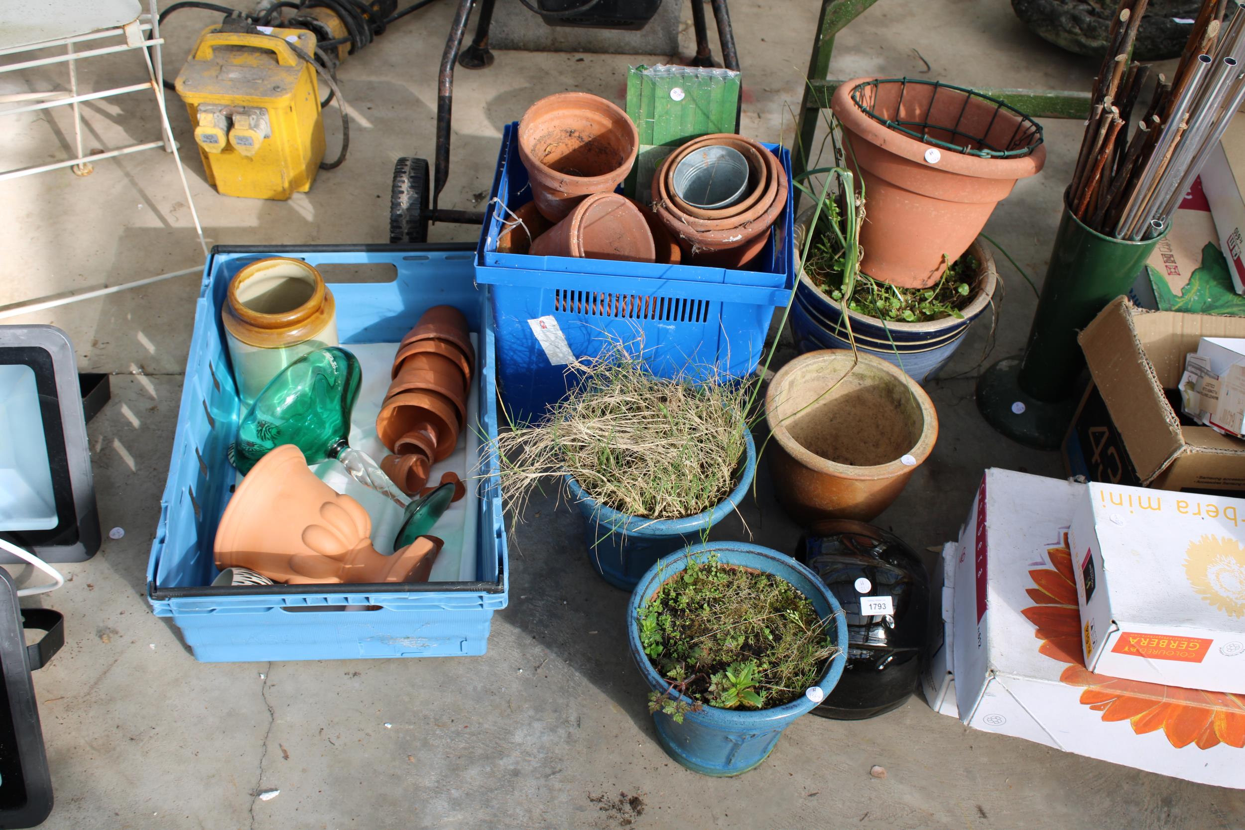 AN ASSORTMENT OF GLAZED AND TERRACOTTA PLANT POTS