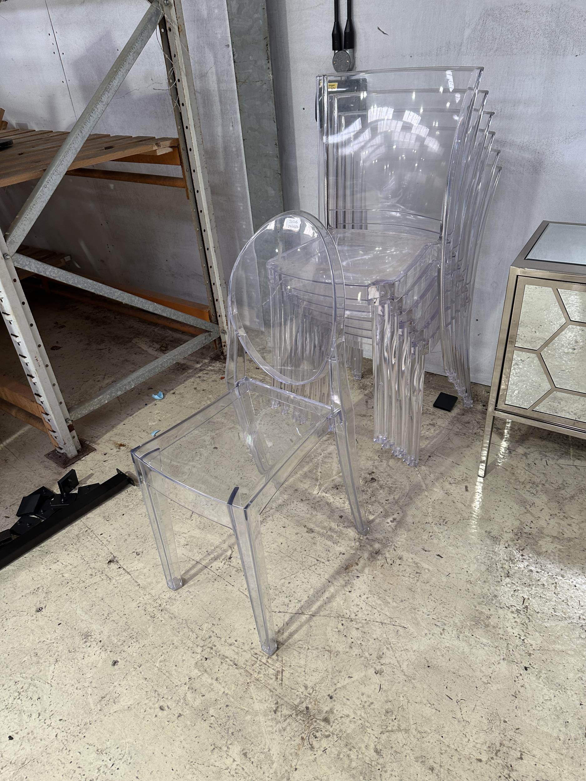 SEVEN MODERN CLEAR PLASTIC STACKING CHAIRS (FROM A DEVELOPER'S SHOW HOME - BELIEVED UNUSED)