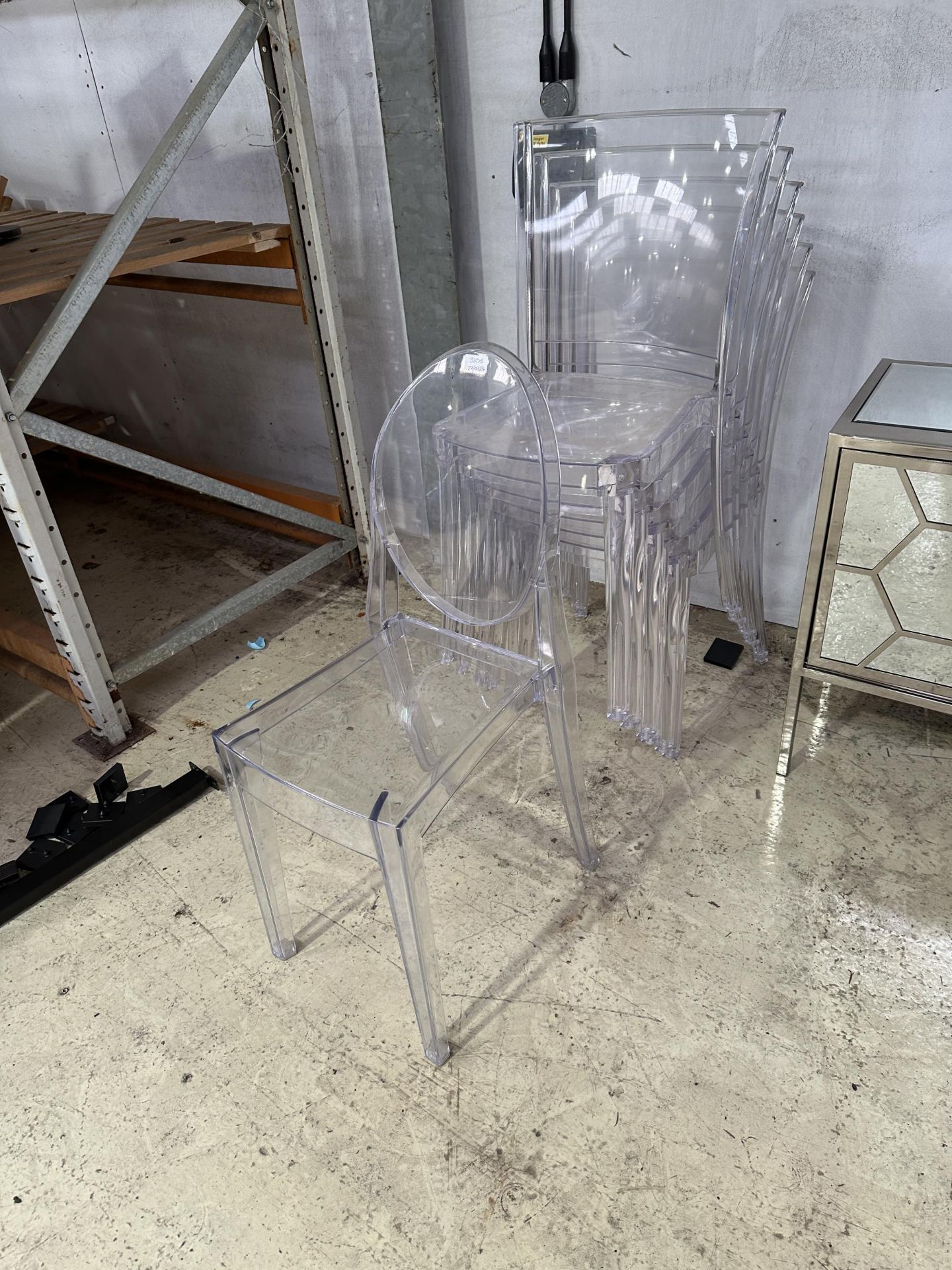 SEVEN MODERN CLEAR PLASTIC STACKING CHAIRS (FROM A DEVELOPER'S SHOW HOME - BELIEVED UNUSED)
