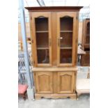 A BEECH TWO DOOR BOOKCASE ON BASE 41" WIDE