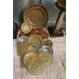 A LARGE ASSORTMENT OF VINTAGE BRASS AND COPPER WALL CHARGERS