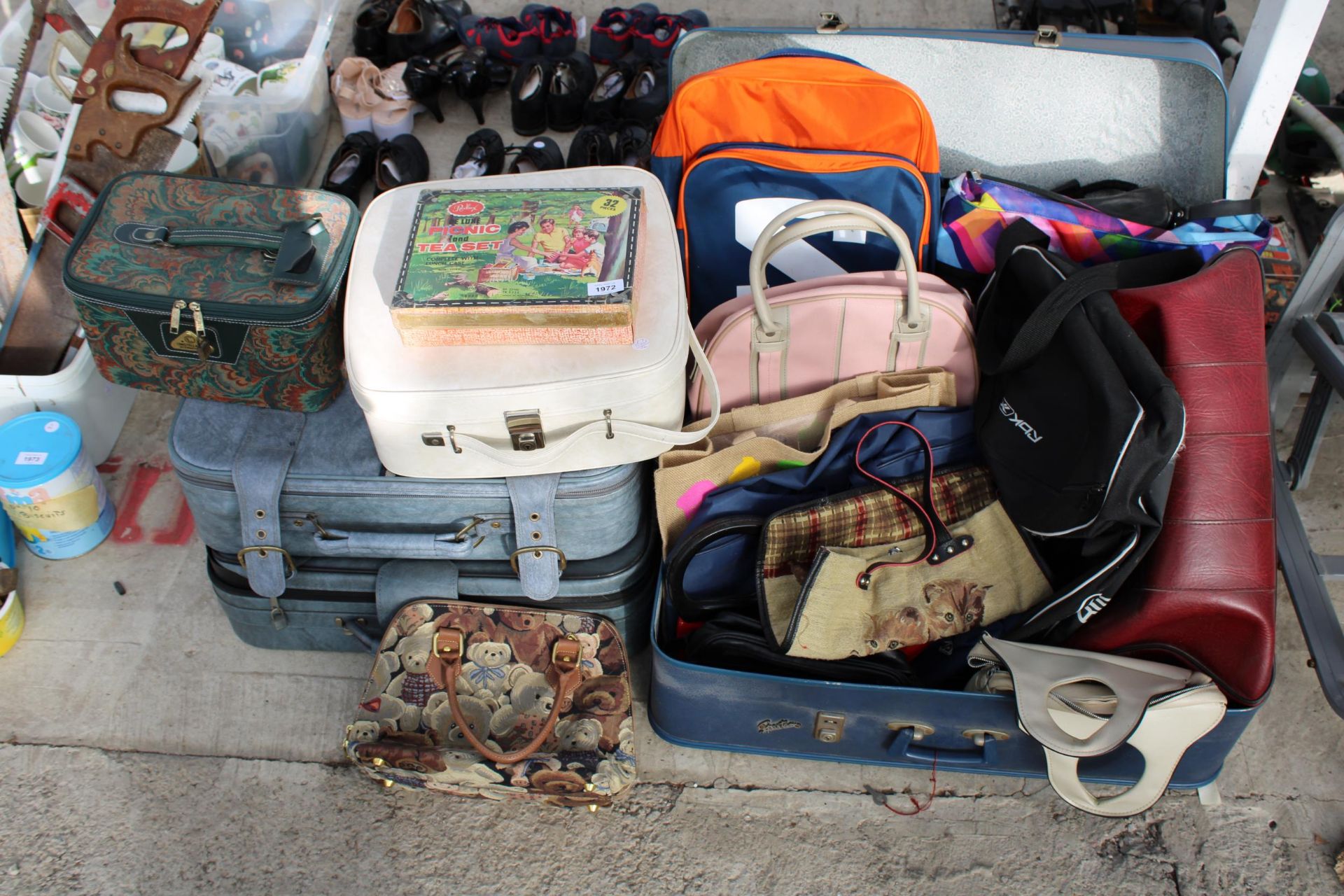 A LARGE ASSORTMENT OF BAGS AND SUITCASES ETC