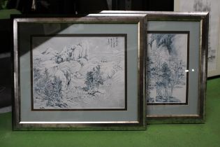 A PAIR OF FRAMED ORIENTAL PRINTS