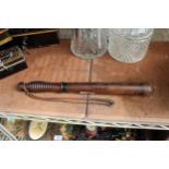 A VINTAGE WOODEN POLICE TRUNCHEON