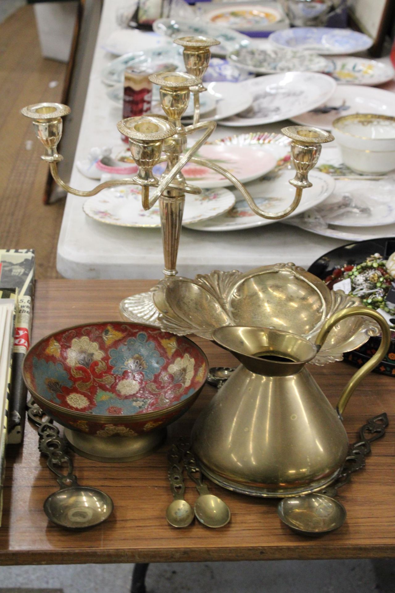 A SILVER PLATED CANDLEABRA AND ORNATE FOOTED BOWL, BRASS CLOISONNE FOOTED BOWL, PLUS BRASS JUG AND