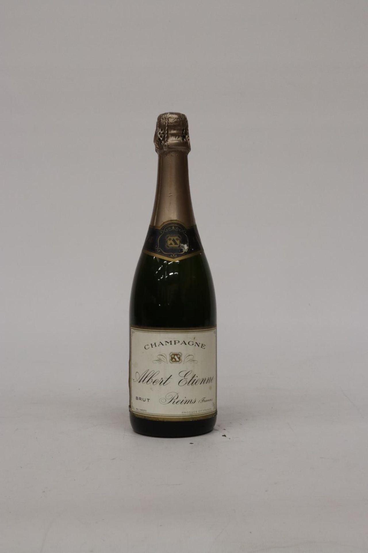 A BOTTLE OF ALBERT ETIENNE CHAMPAGNE