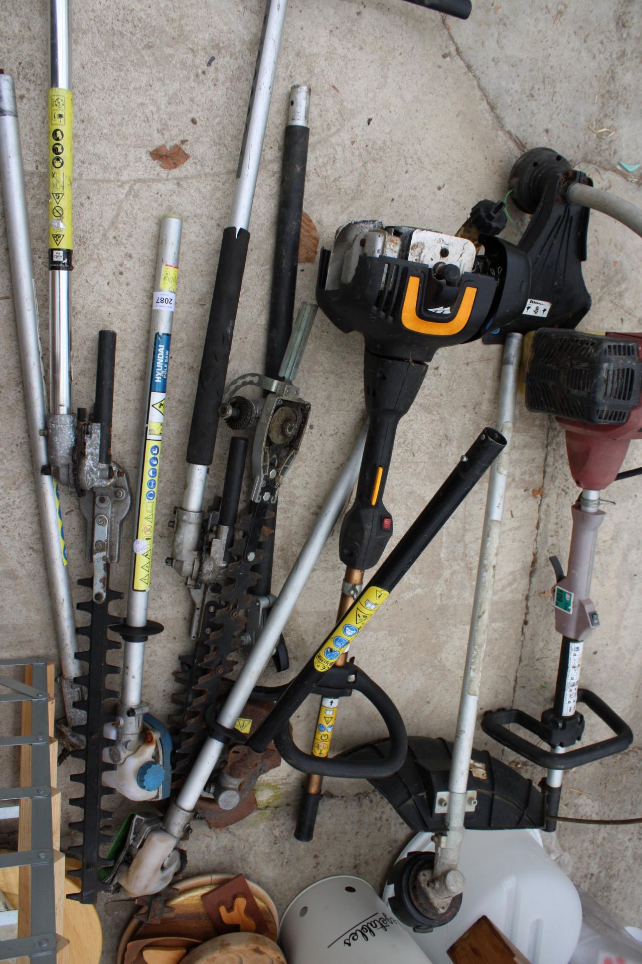 TWO PETROL STRIMMER BODIES AND AN ASSORTMENT OF LONG REACH HEDGE TRIMMER ATTATCHMENTS AND STRIMMER - Image 2 of 3