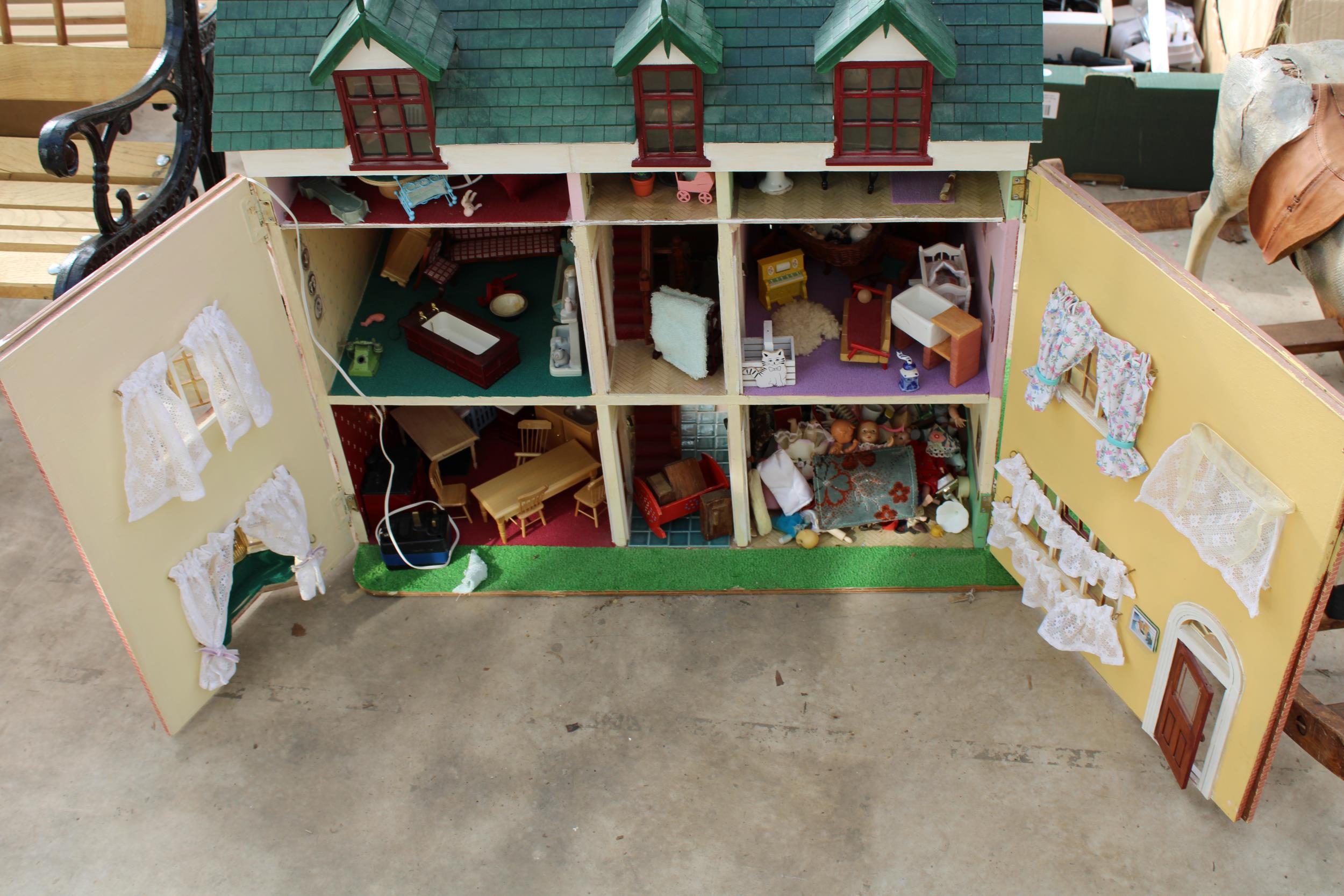 A LARGE WOODEN DOLLS HOUSE WITH A LARGE QUANTITY OF DOLLS HOUSE FURNITURE - Image 2 of 6