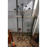A PAIR OF METAL CANDLESTICKS AND A FURTHER 5 BRANCH METAL CANDLESTICK