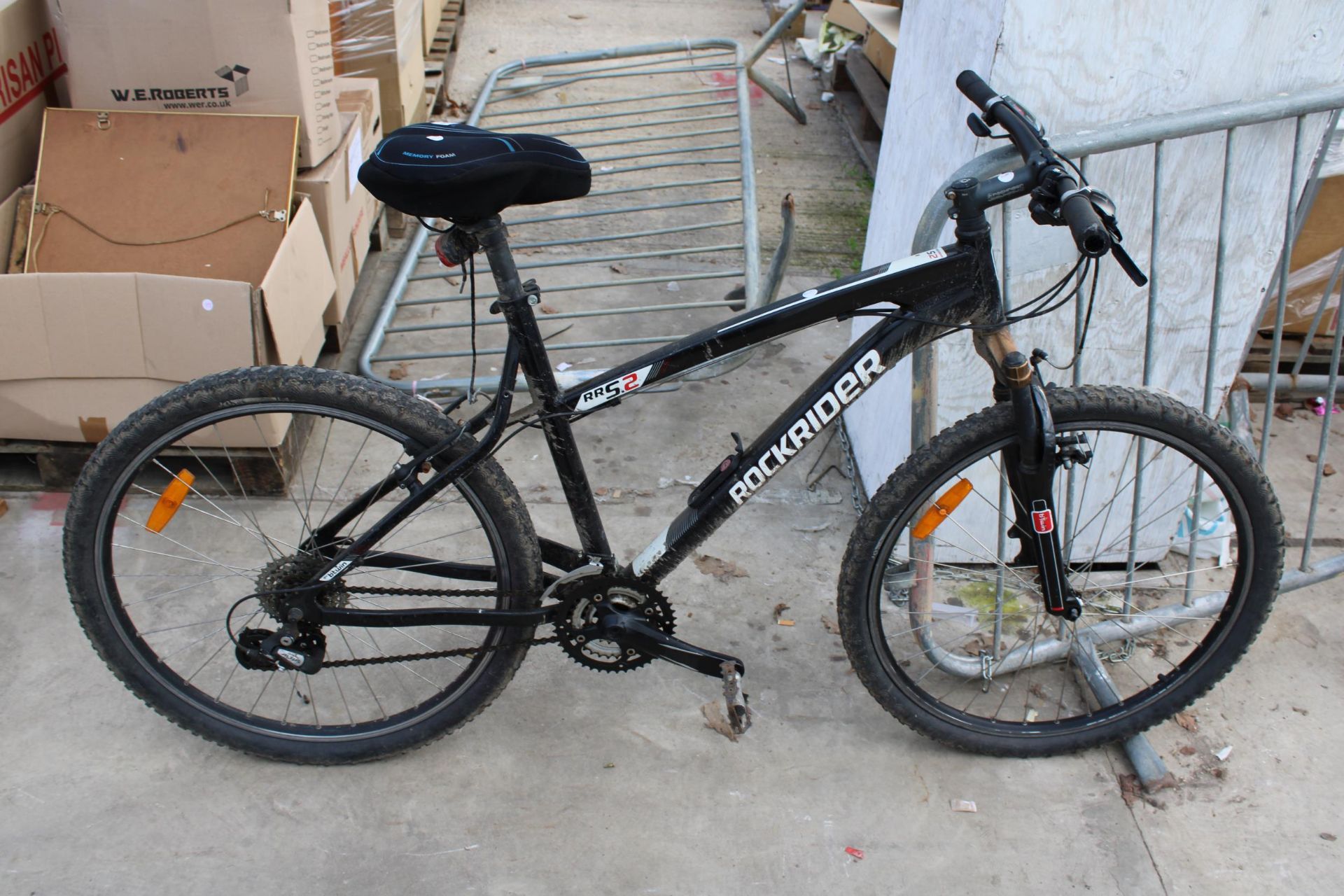 A ROCKRIDER RRS2 MOUNTAIN BIKE WITH FRONT SUSPENSION AND 24 SPEED SHIMANO GEAR SYSTEM
