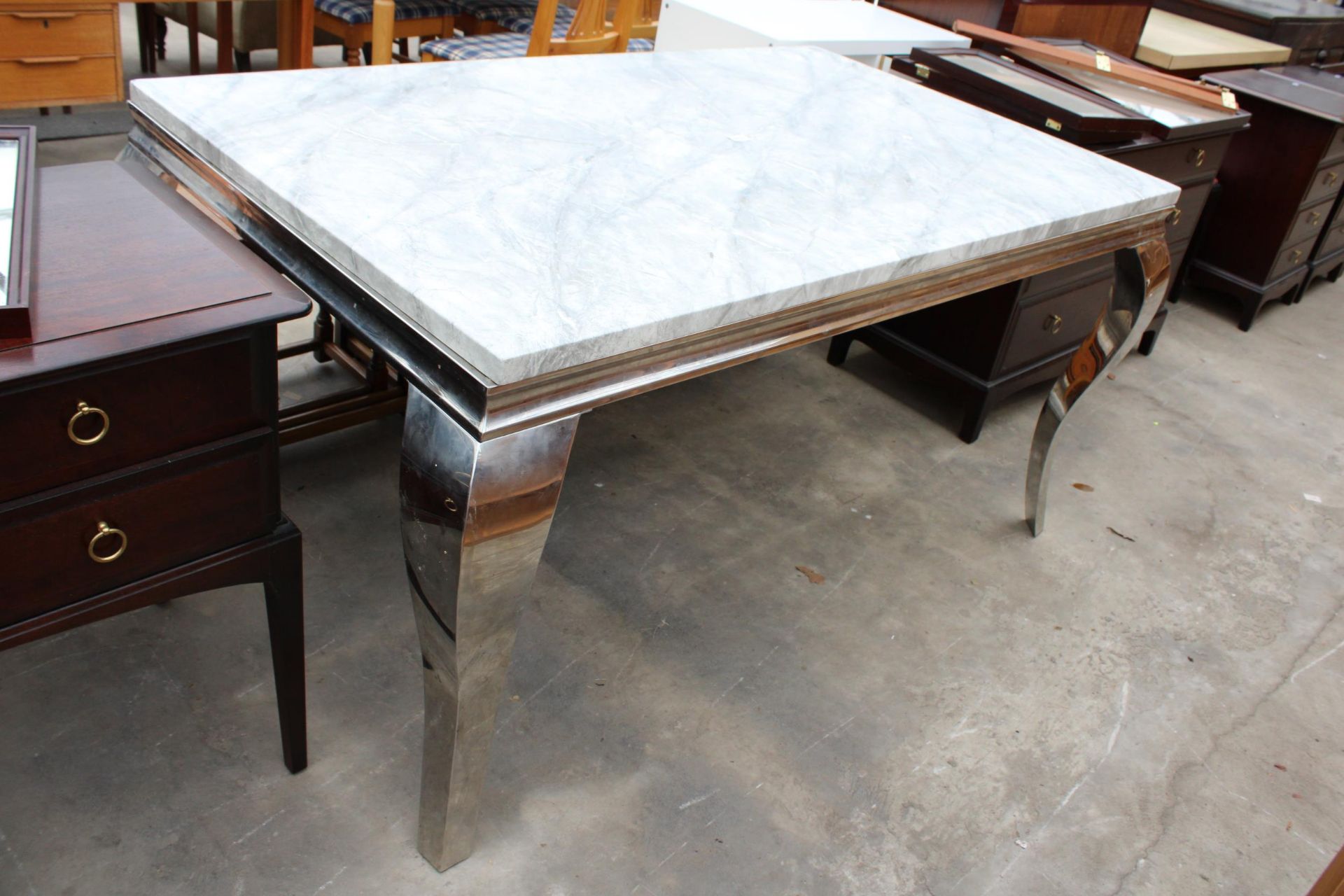 A MARBLE EFFECT DINING TABLE 59" X 36" ON POLISHED CHROME LEGS