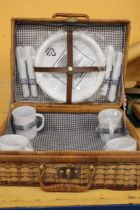 A WICKER PICNIC BASKET AND CONTENTS