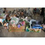 A LARGE ASSORTMENT OF GARDEN ITEMS TO INCLUDE METAL PLANT BASKETS, ARTIFICIAL FLOWERS AND WICKER