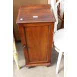 A VICTORIAN MAHOGANY POT CUPBOARD ON TURNED LEGS