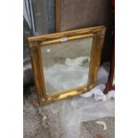 A GILT FRAMED BEVEL EDGED WALL MIRROR 26" X 21"