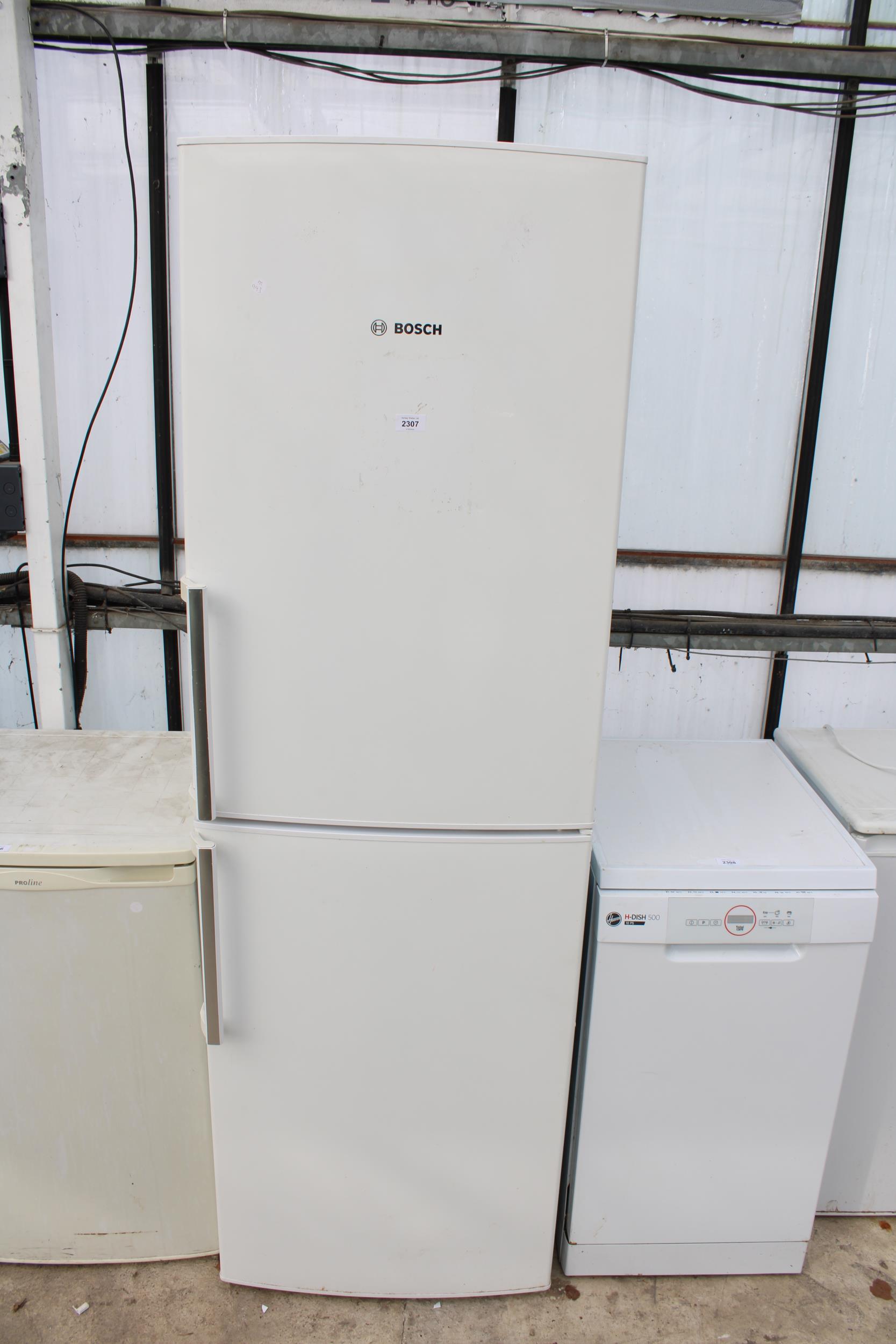 A TALL WHITE BOSCH UPRIGHT FRIDGE FREEZER