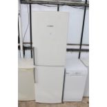 A TALL WHITE BOSCH UPRIGHT FRIDGE FREEZER