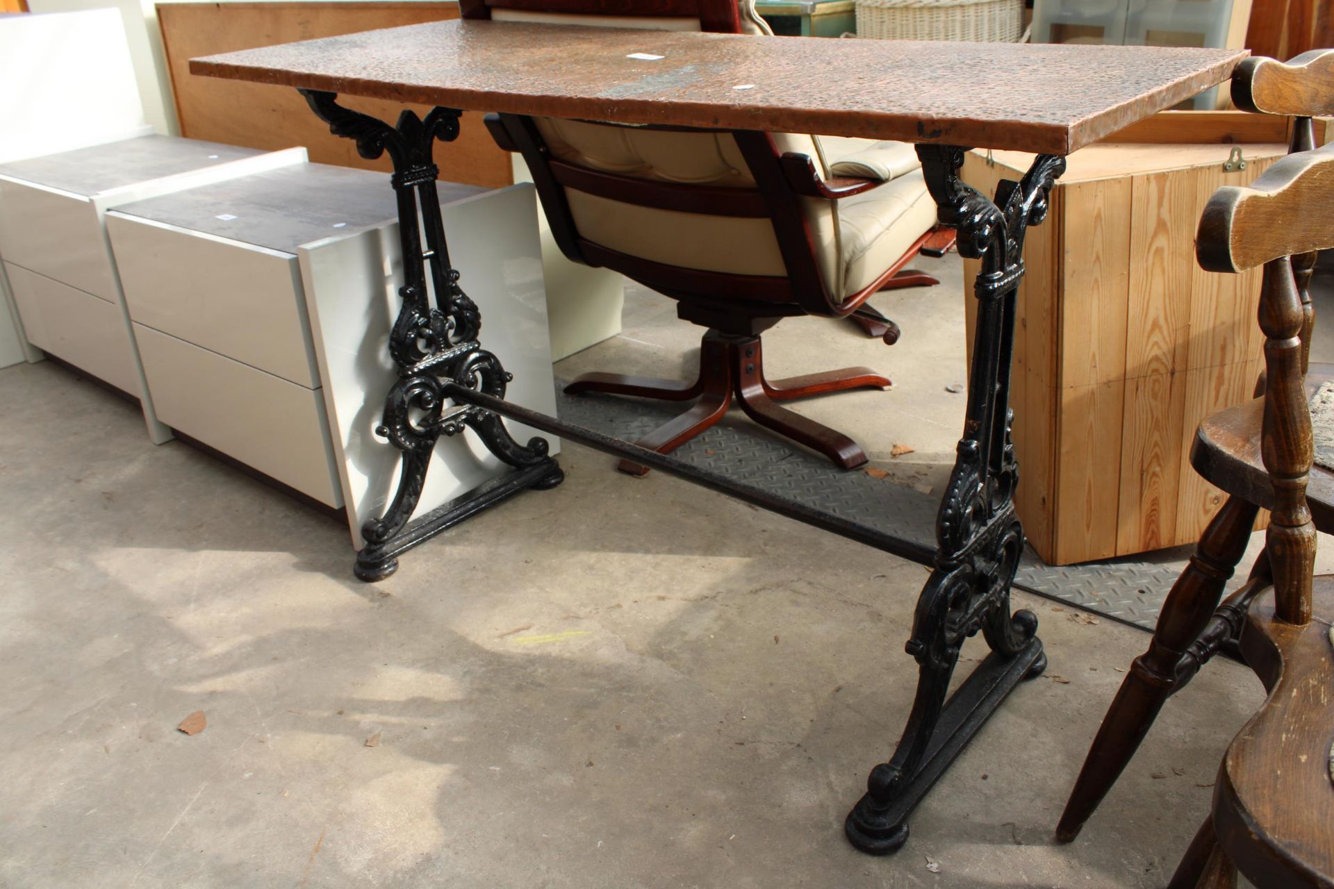 A PUB TABLE WITH AN EMBOSSED COPPER TOP 45" X 18" ON A CAST IRON BASE - Image 2 of 2