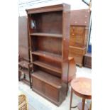 A MID 20TH CENTURY FOUR TIER SECTIONAL MINTY BOOKCASE WITH CUPBOARDS TO BASE 35" WIDE