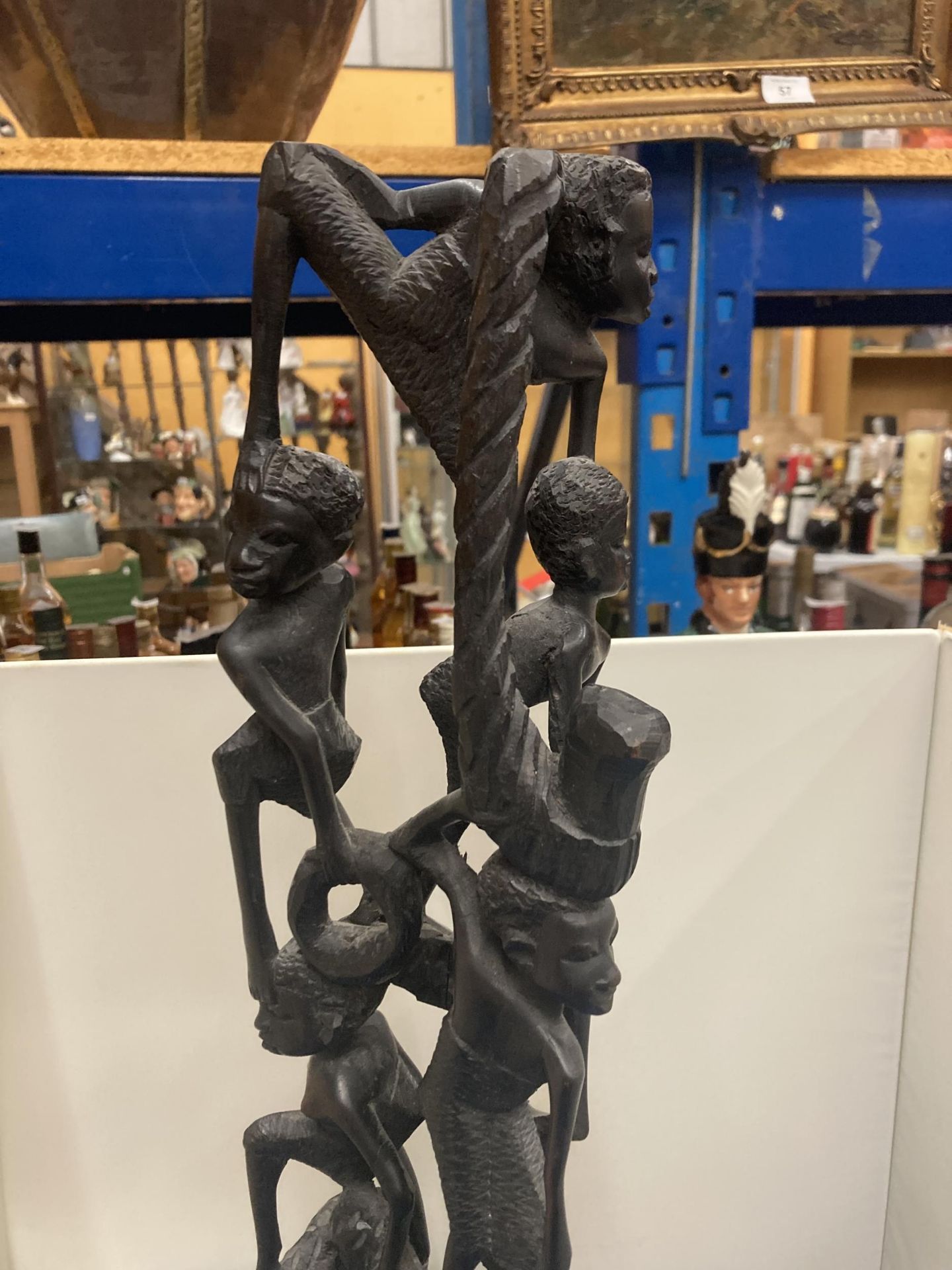 A HEAVILY CARVED AFRICAN EBONY FIGURE APPROX 56CM TALL - Image 3 of 4