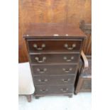 A MODERN MAHOGANY CHEST OF FIVE GRADUATED DRAWERS BEARING WARING AND GILLOW LABEL
