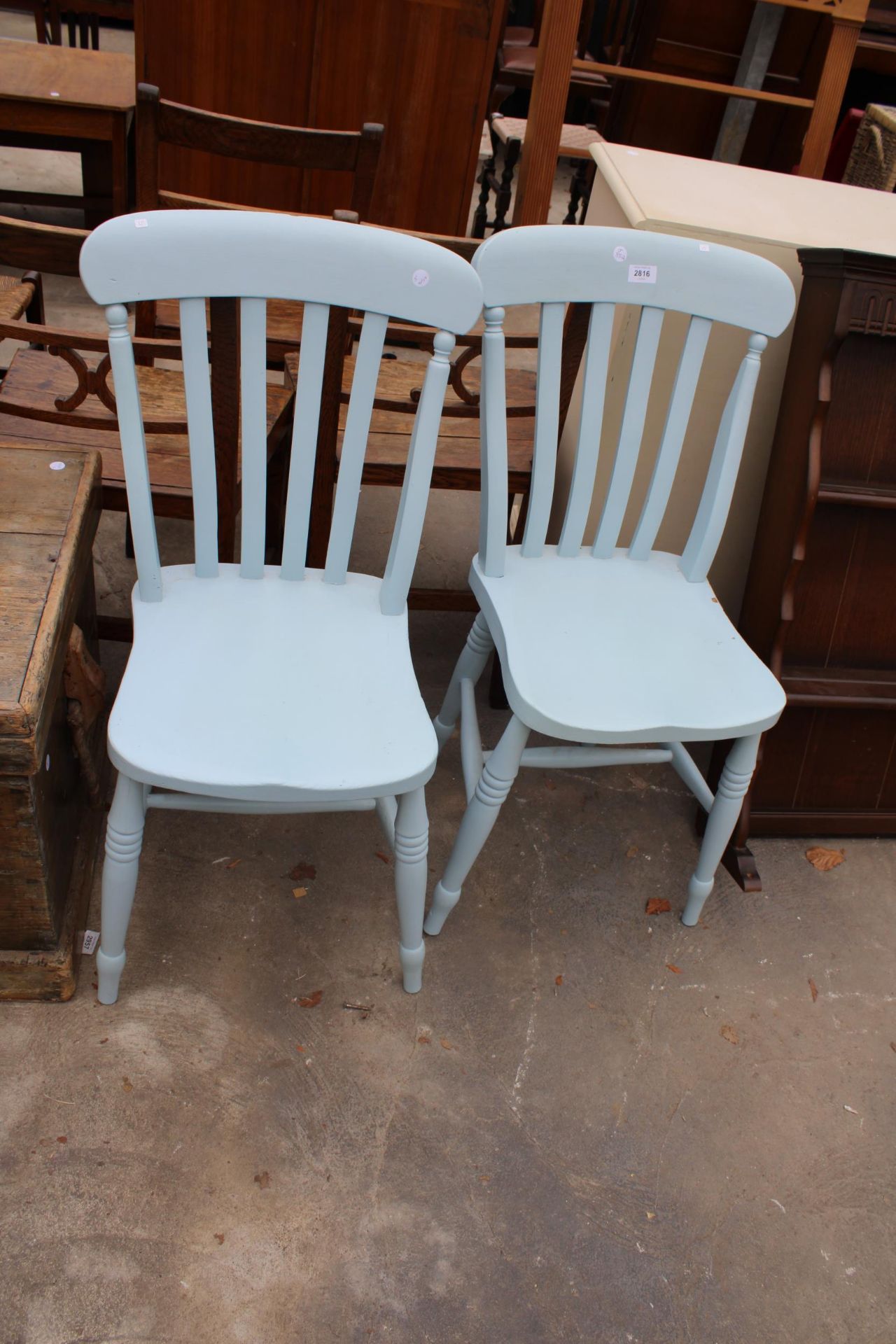 A PAIR OF PAINTED VICTORIAN KITCHEN CHAIRS