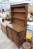 A REPRODUCTION OAK DRESSER WITH PLATE RACK 37" WIDE