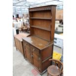 A REPRODUCTION OAK DRESSER WITH PLATE RACK 37" WIDE