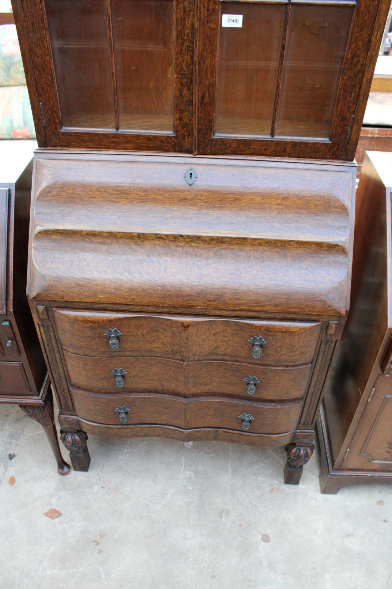 A EARLY 20TH CENTURY OAK SERPENTINE FRONTED BUREAU BOOKCASE WITH RETRACTABLE FITTED INTERIOR 29" - Image 2 of 6