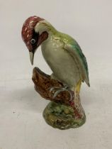 A BESWICK GREEN WOODPECKER IN A GLOSS FINISH No 1218