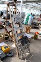 A VINTAGE WOODEN FIVE RUNG STEP LADDER, A FIVE RUNG ALUMINIUM STEP LADDER AND A FOLDING STEP STOOL