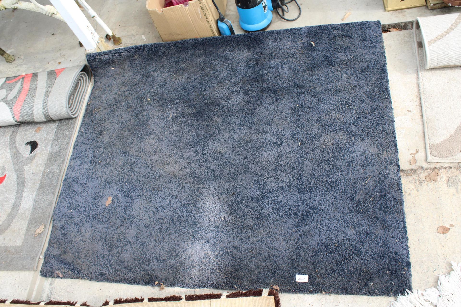 A MODERN BLUE RUG