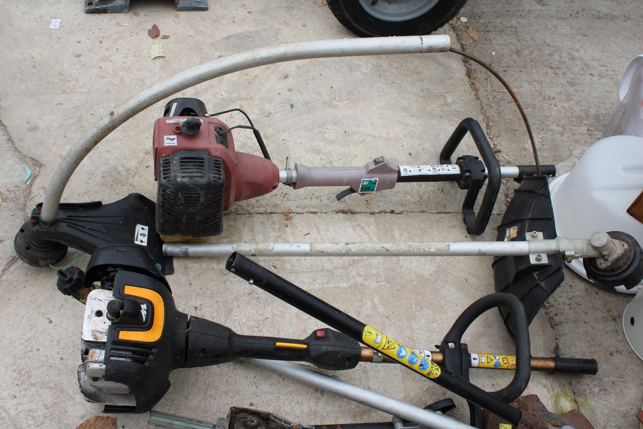 TWO PETROL STRIMMER BODIES AND AN ASSORTMENT OF LONG REACH HEDGE TRIMMER ATTATCHMENTS AND STRIMMER - Image 3 of 3