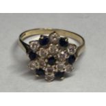 A 9 CARAT GOLD RING WITH SAPPHIRES AND CUBIC ZIRCONIAS IN A CLUSTER DESIGN M/N
