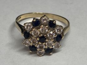 A 9 CARAT GOLD RING WITH SAPPHIRES AND CUBIC ZIRCONIAS IN A CLUSTER DESIGN M/N