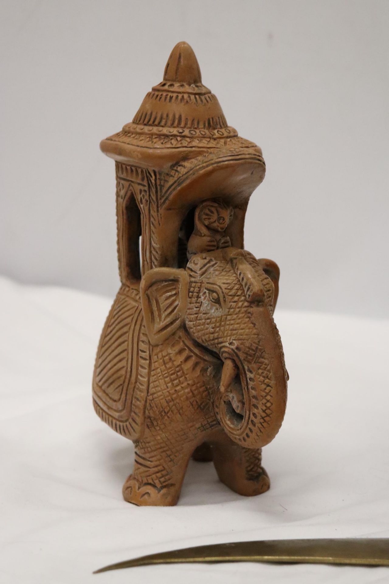 A HARDWOOD CARVED ELEPHANT, STONE ELEPHANT, MISSING A LEG AND A BRASS KNIFE - Image 2 of 12