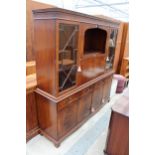 REPRODUCTION MAHOGANY AND CROSSBANDED BOOKCASE / BUREAU ON BASE 70" WIDE