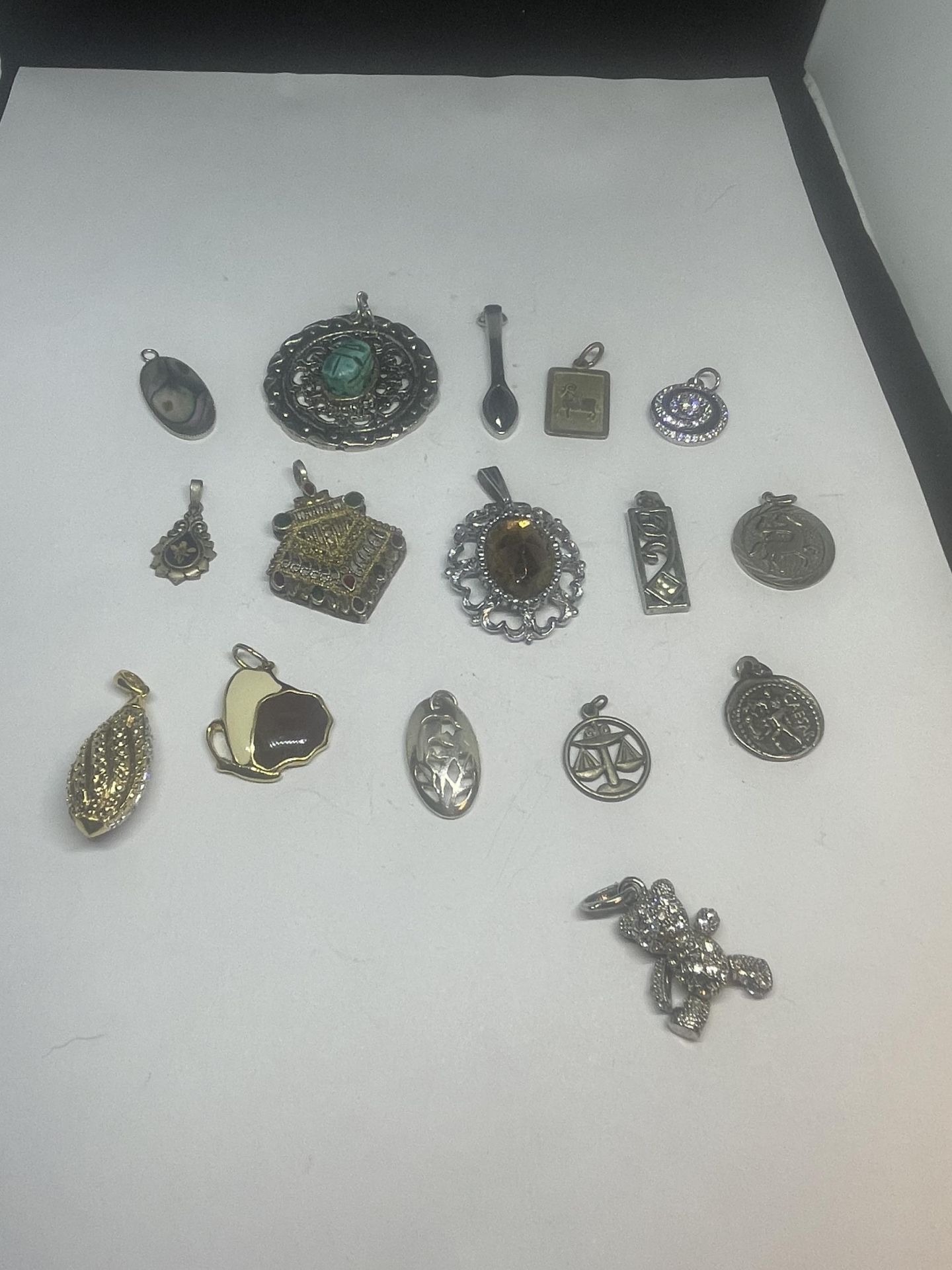 SIXTEEN VARIOUS VINTAGE PENDANTS