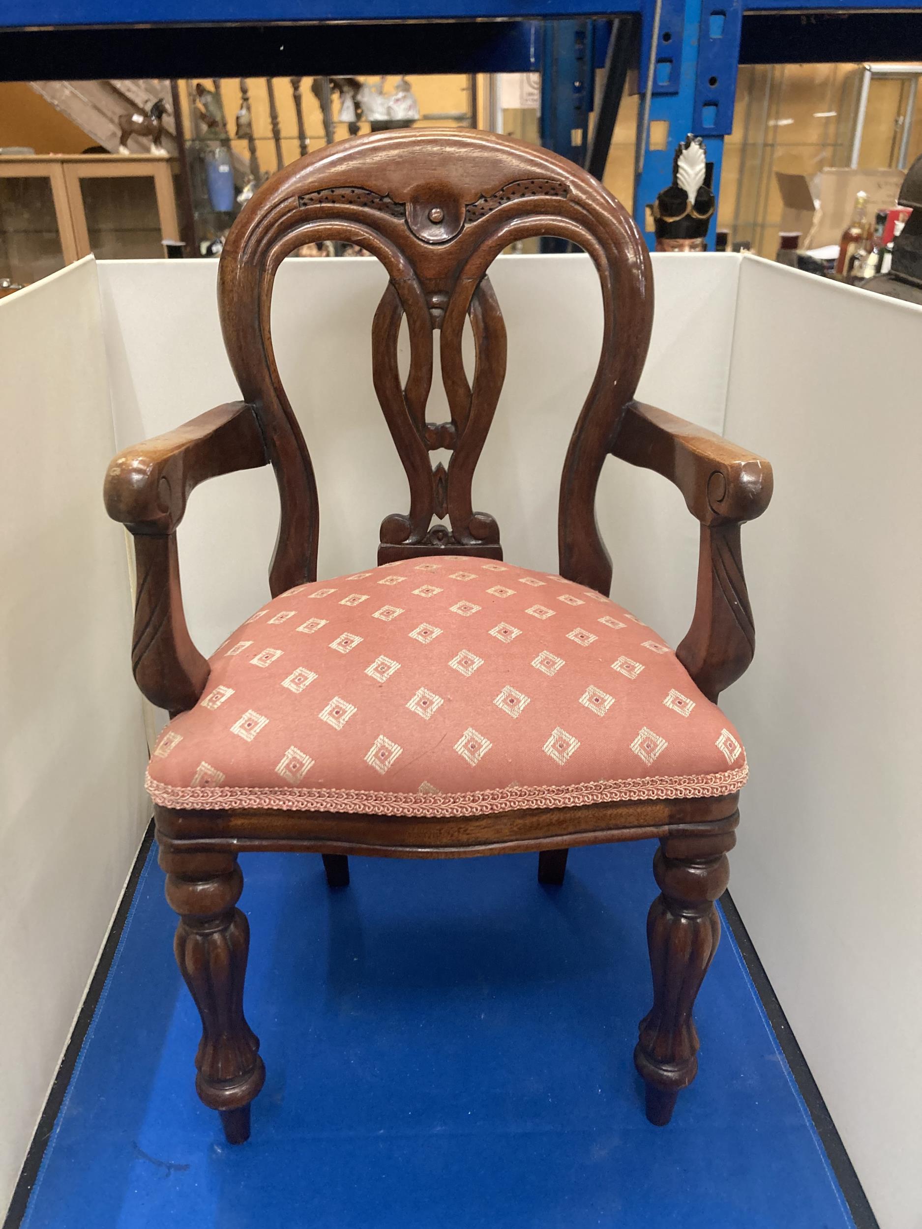 A VICTORIAN UPHOLSTERED CARVER DOLLS CHAIR