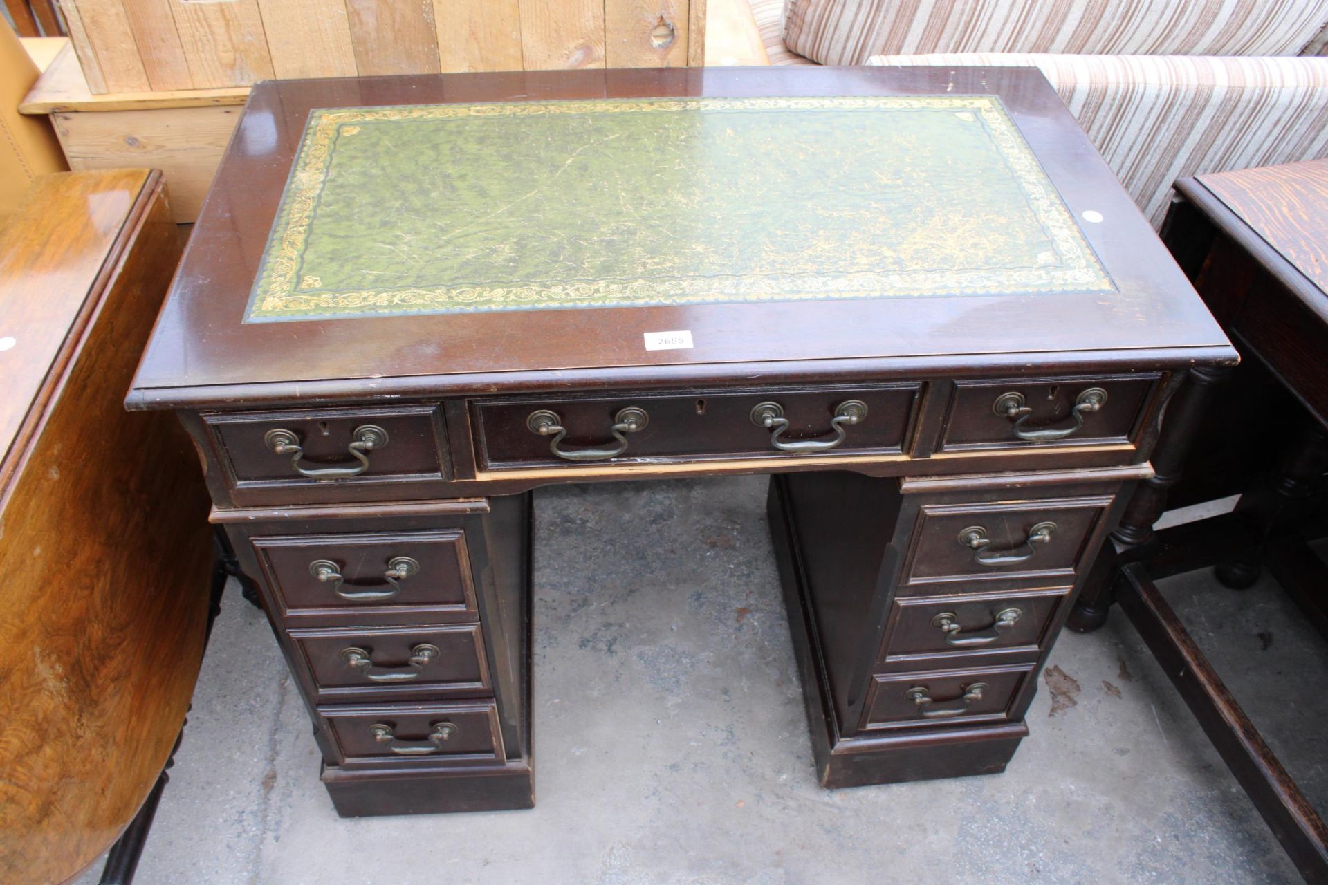 A TWIN PEDESTAL DESK WITH INSET LEATHER TOP 37" X 21"