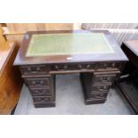 A TWIN PEDESTAL DESK WITH INSET LEATHER TOP 37" X 21"