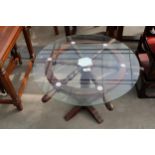 A COFFEE TABLE 24" DIAMETER THE BASE IN THE FORM OF A SHIPS WHEEL