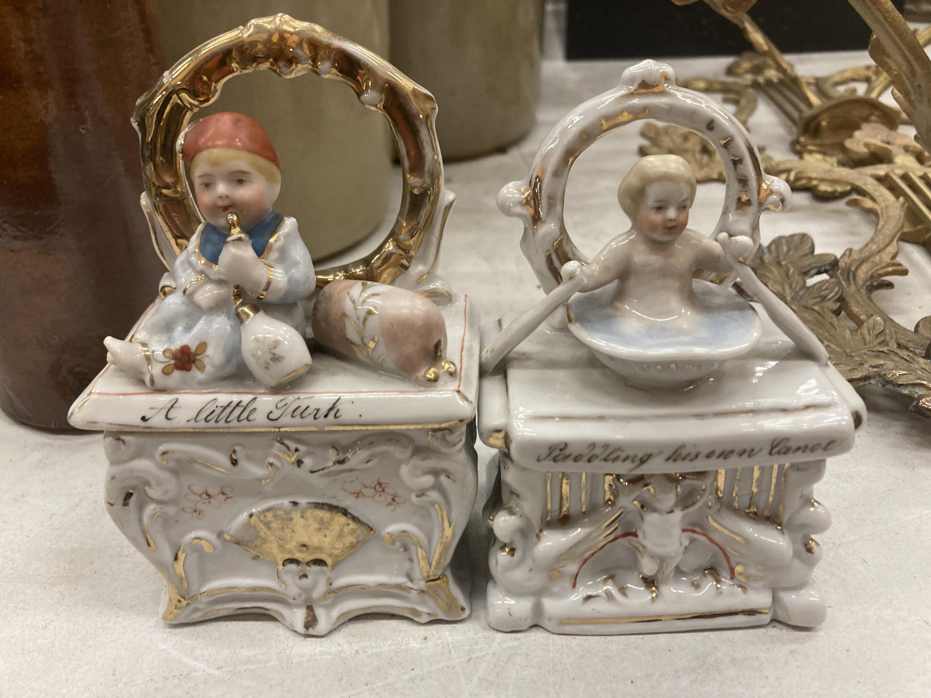 TWO VINTAGE GERMAN FAIRINGS TRINKET BOXES, TO INCLUDE 'A LITTLE TURK' - RESTORED AND 'PADDLING HIS