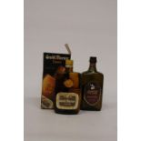 A 50CL BOTTLE OF GRAND MARNIER LIQUOR WITH BOX AND A 70CL BOTTLE OF AMARETTO ITALIANO