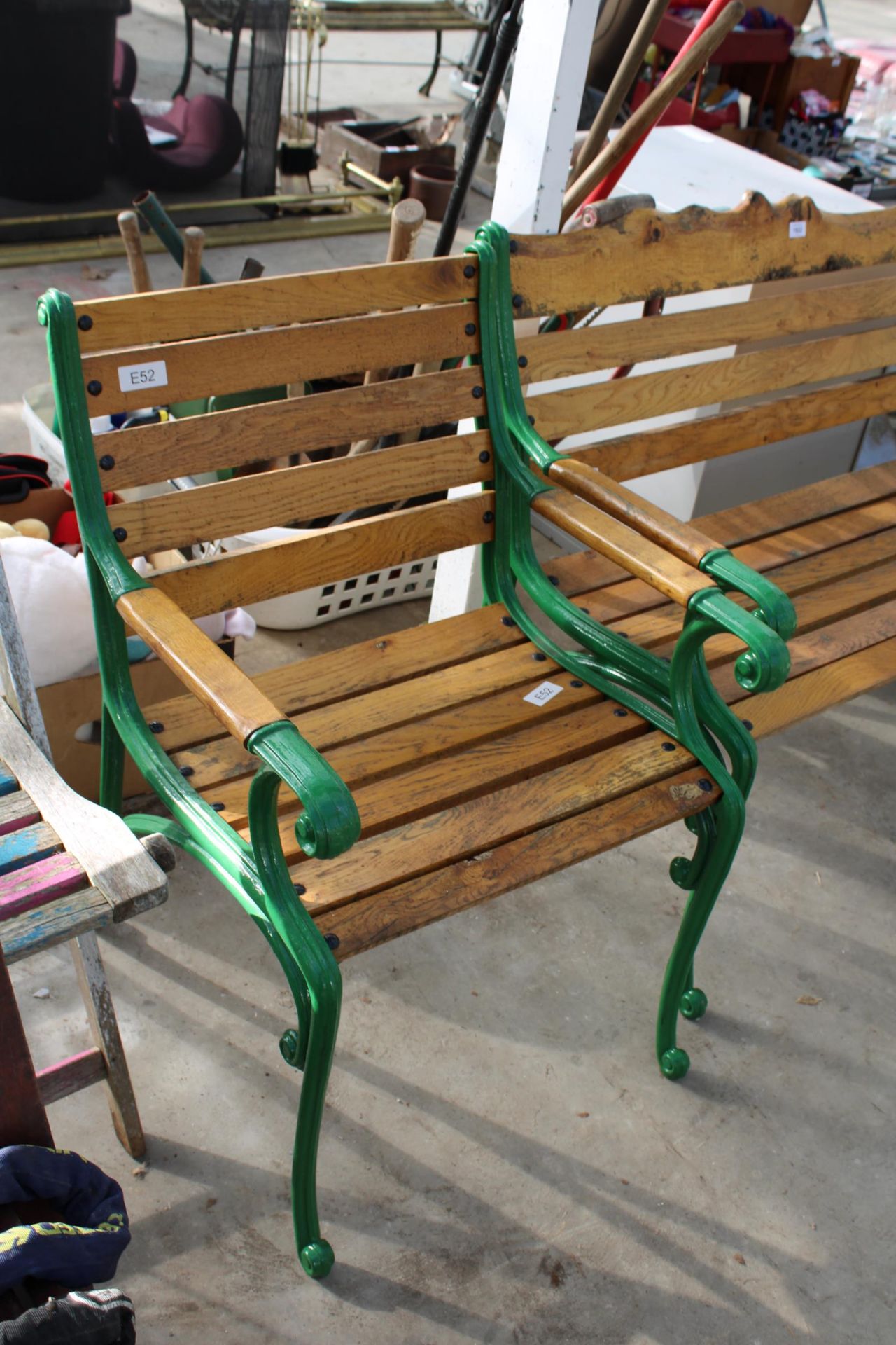 A WOODEN SLATTED GARDEN BENCH AND CHAIR BOTH WITH CAST ENDS - Image 2 of 3