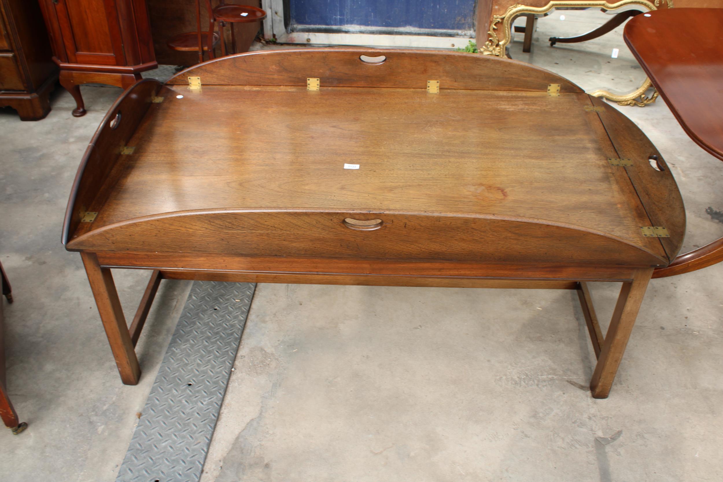 A GEORGIAN STYLE MAHOGANY COFFEE TABLE IN THE FORM OF A BUTLERS TRAY FULLY OPENED, 64" X 43"