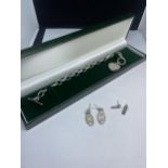 A HEAVY SILVER T BAR BRACELET WITH PEARLISED HEART CHARM AND TWO PAIRS OF SILVER EARRINGS IN A