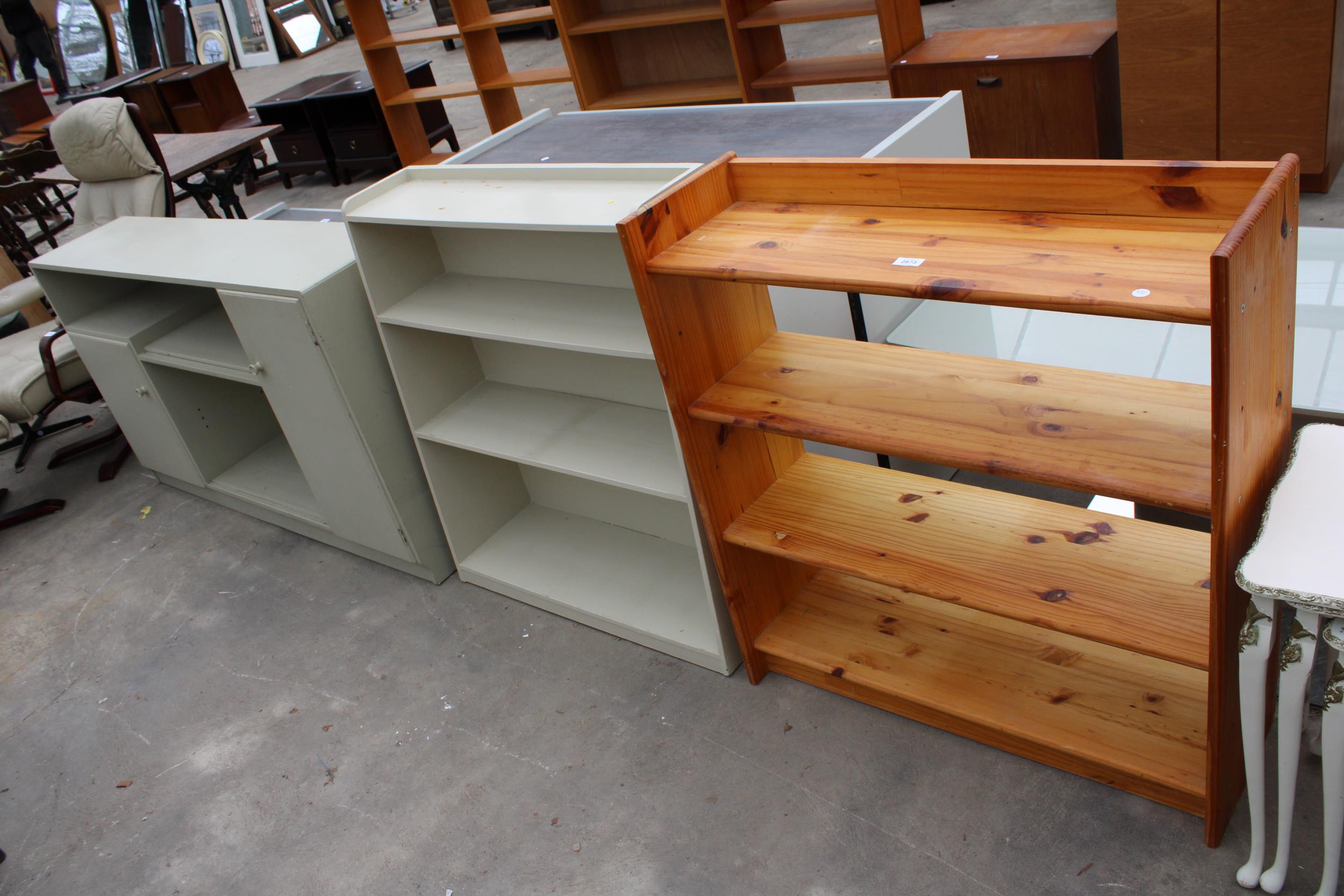 A PINE OPEN BOOKCASE, PAINTED OPEN BOOKCASE AND PAINTED CUPBOARD WITH OPEN SHELVES