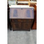 A REPRODUCTION MAHOGANY AND CROSSBANDED BUREAU WITH FITTED INTERIOR 29" WIDE